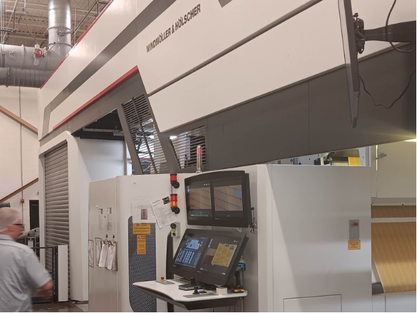 Flexographic printing press, newly installed, manned by operator