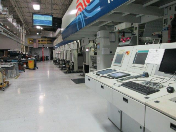 Gravure printing press, ink towers in a row, clean floors