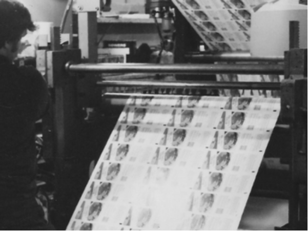 black and white photo of original gravure press ran by operator